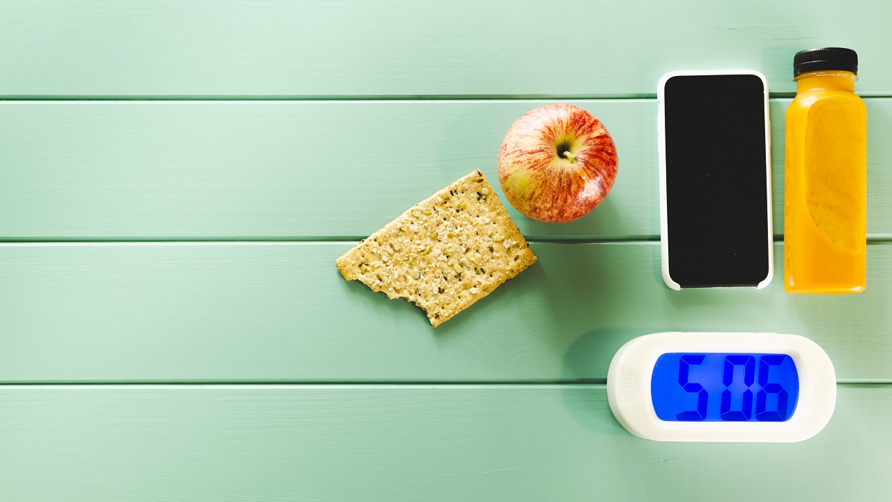 healthy-food-composition-with-alarm-clock
