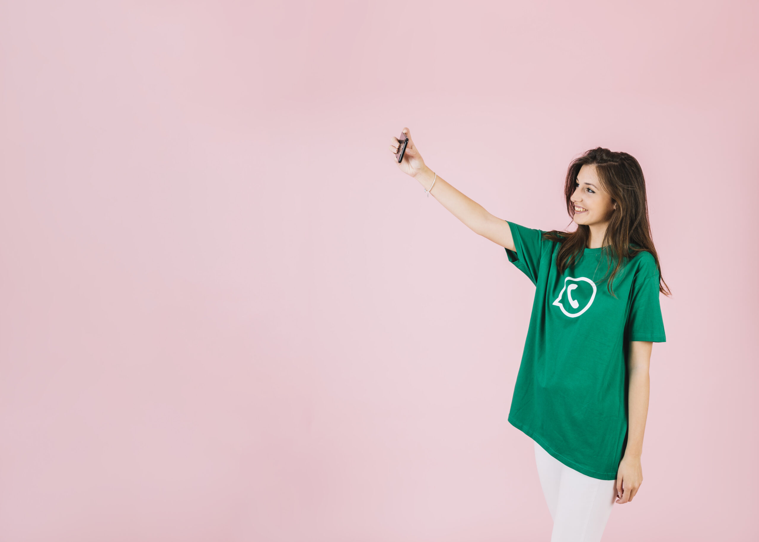 woman-taking-selfie-cellphone-wearing-whatsapp-icon-t-shirt