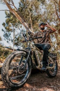 Hunting ebike in the wild with a portable charging station.