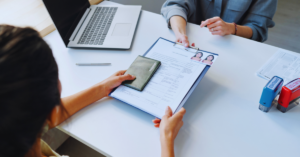 Couple completing Partner Visa 820 application form together