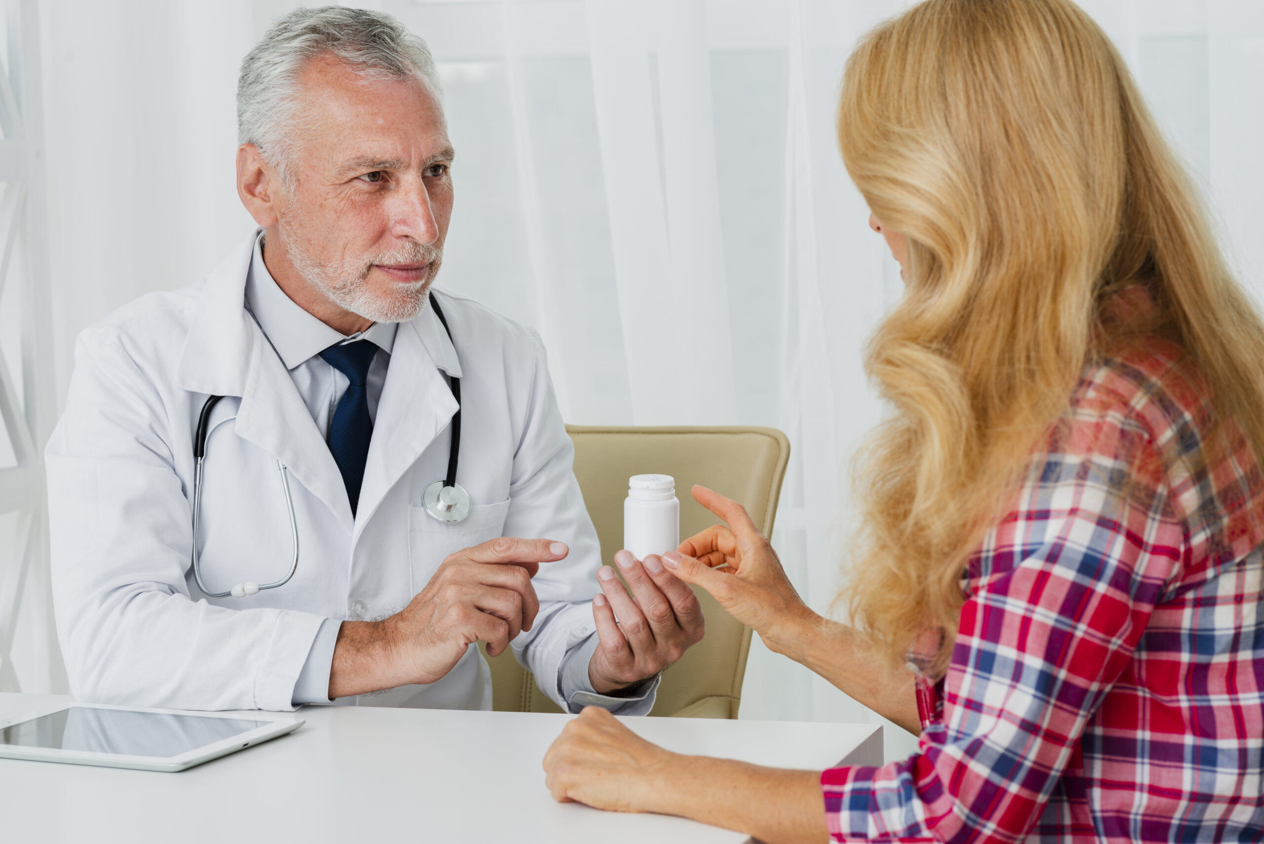 doctor-handing-medication-patient