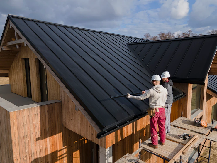 full-shot-roofers-working-together-with-helmets_23-2149343707