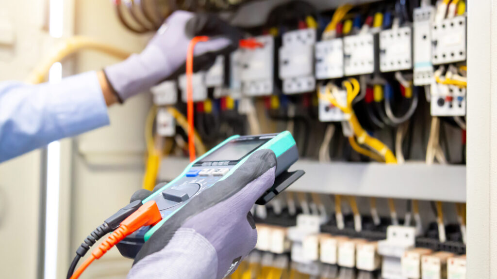 Electrical,Engineer,Using,Digital,Multi-meter,Measuring,Equipment,To,Checking,Electric